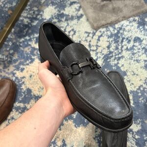 Salvatore Ferragamo Grandioso Gancini bit loafers in black pebbled leather.